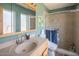 Bathroom features a sink, toilet, and tiled glass-enclosed shower at 6428 E Shea Blvd, Scottsdale, AZ 85254