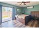 Bedroom with a queen bed, ceiling fan, and sliding glass door to the patio at 6428 E Shea Blvd, Scottsdale, AZ 85254