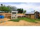 This backyard features a chicken coop and a partially constructed building, providing space for farm animals at 6428 E Shea Blvd, Scottsdale, AZ 85254