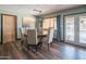 Cozy dining room with a round table, six chairs, and a view of the pool at 6428 E Shea Blvd, Scottsdale, AZ 85254