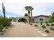 Modern home with unique architecture, desert landscaping, and a stylish entrance at 6428 E Shea Blvd, Scottsdale, AZ 85254
