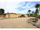 This house features a driveway, an attached garage, and desert landscaping at 6428 E Shea Blvd, Scottsdale, AZ 85254