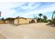 This house features a driveway, an attached garage, and desert landscaping at 6428 E Shea Blvd, Scottsdale, AZ 85254