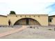 Unique archway entrance with decorative rock landscaping and desert accents at 6428 E Shea Blvd, Scottsdale, AZ 85254