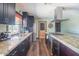 Modern kitchen boasts stainless appliances, granite countertops, and dark cabinets at 6428 E Shea Blvd, Scottsdale, AZ 85254