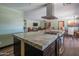Spacious open concept kitchen with stainless appliances and large granite island at 6428 E Shea Blvd, Scottsdale, AZ 85254