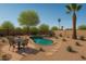 Backyard pool with a desert landscape, including a stone pathway and various plants at 6428 E Shea Blvd, Scottsdale, AZ 85254