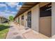 Charming front door with security screen, desert landscaping, and an American flag at 6721 E Mcdowell Rd # H324, Scottsdale, AZ 85257
