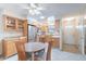 Cozy kitchen with stainless steel refrigerator and dining area near front door at 6721 E Mcdowell Rd # H324, Scottsdale, AZ 85257