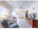 Comfortable living room with tile flooring, ceiling fan, and view of entryway at 6721 E Mcdowell Rd # H324, Scottsdale, AZ 85257