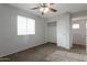 Bedroom featuring neutral walls, carpet flooring, and a ceiling fan for added comfort at 7336 S 48Th Gln, Laveen, AZ 85339