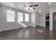 Bright living area featuring sleek floors, neutral walls, and ample natural light from multiple windows at 7336 S 48Th Gln, Laveen, AZ 85339