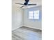 Bedroom featuring wood-look floors, ceiling fan, and window at 7420 N 58Th Ave, Glendale, AZ 85301