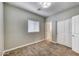 Neutral bedroom featuring carpet, a double door closet, and a window that lets in natural light at 815 E Rose Ln # 105, Phoenix, AZ 85014