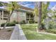 Multi-story building with well-maintained green spaces and walking paths, offering a peaceful outdoor environment at 815 E Rose Ln # 105, Phoenix, AZ 85014