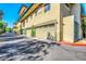 Attached garage with automatic door offers secure parking and convenience, with beautiful landscaping at 815 E Rose Ln # 105, Phoenix, AZ 85014