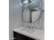Stylish powder room with decorative wall tiles, modern vanity, and quartz countertop at 815 E Rose Ln # 105, Phoenix, AZ 85014