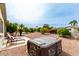 Backyard with desert landscaping, patio furniture, mature trees, and well-maintained space, offering inviting outdoor area at 8229 E Farmdale Dr, Mesa, AZ 85208