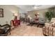 Comfortable living room boasts tile floors, neutral colors, ceiling fan, and stylish decor at 8229 E Farmdale Dr, Mesa, AZ 85208