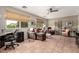 Bright living room with tile flooring, multiple seating options, and natural light at 8229 E Farmdale Dr, Mesa, AZ 85208