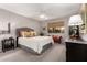 Cozy main bedroom with a neutral color palette and a ceiling fan at 8229 E Farmdale Dr, Mesa, AZ 85208