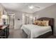 Comfortable main bedroom with ceiling fan and ensuite bathroom access at 8229 E Farmdale Dr, Mesa, AZ 85208