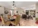 Open floorplan view of dining area and living room with lots of natural light at 8229 E Farmdale Dr, Mesa, AZ 85208