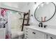 Bright bathroom features a shower/tub combo and a stylish vanity with a ladder shelf at 860 N Mcqueen Rd # 1213, Chandler, AZ 85225
