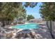 Community pool and picnic area surrounded by mature trees, creating a relaxing outdoor space at 860 N Mcqueen Rd # 1213, Chandler, AZ 85225
