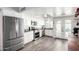 Modern kitchen featuring stainless steel appliances, white cabinets, and a door to the patio at 860 N Mcqueen Rd # 1213, Chandler, AZ 85225