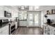 Updated kitchen with stainless appliances, granite countertops, and tile flooring at 860 N Mcqueen Rd # 1213, Chandler, AZ 85225