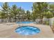 Inviting community pool and hot tub surrounded by mature trees and lounge chairs for relaxation and enjoyment at 860 N Mcqueen Rd # 1213, Chandler, AZ 85225