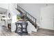 View of staircase, fireplace and console displaying image of house on TV at 860 N Mcqueen Rd # 1213, Chandler, AZ 85225