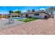 Spacious backyard features a refreshing pool, landscaped area, gravel bed, and lounging spots at 8602 E Whitton Ave, Scottsdale, AZ 85251