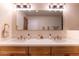Elegant bathroom featuring a double vanity with marble countertops and modern fixtures at 8602 E Whitton Ave, Scottsdale, AZ 85251