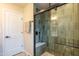 Stylish bathroom boasts an updated shower with a glass enclosure and tiled walls at 8602 E Whitton Ave, Scottsdale, AZ 85251