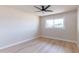 Bright and airy bedroom with ceiling fan and natural light from the large window at 8602 E Whitton Ave, Scottsdale, AZ 85251