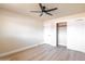 Bright bedroom features ceiling fan, closet with sliding doors, and neutral color palette at 8602 E Whitton Ave, Scottsdale, AZ 85251