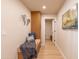 Inviting hallway with bench, storage, decor, and access to other rooms in the home at 8602 E Whitton Ave, Scottsdale, AZ 85251
