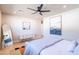 Spacious main bedroom featuring a ceiling fan, stylish furnishings, and contemporary decor at 8602 E Whitton Ave, Scottsdale, AZ 85251