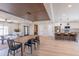 Bright, open floor plan featuring kitchen, dining, and living areas with natural light and modern decor at 8602 E Whitton Ave, Scottsdale, AZ 85251