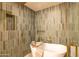 Modern shower and soaking tub featuring stylish tile and fixtures for a luxurious experience at 8602 E Whitton Ave, Scottsdale, AZ 85251