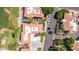 Aerial view features well-maintained community with tile rooftops, ample parking, green spaces, and mature trees at 8841 S 51St St # 1, Phoenix, AZ 85044