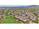 A lovely aerial showcases the community's unique setting near the golf course and mountain views at 8841 S 51St St # 1, Phoenix, AZ 85044