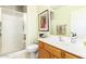 Updated bathroom with tiled walk-in shower, modern vanity, white counter tops, and neutral wall color at 8841 S 51St St # 1, Phoenix, AZ 85044
