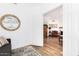 Bright entryway featuring hardwood floors and an open doorway leading to a cozy living space at 8841 S 51St St # 1, Phoenix, AZ 85044