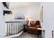 Loft area with cozy chair, reading lamp, and neutral tones at 8841 S 51St St # 1, Phoenix, AZ 85044