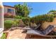 Relaxing patio area featuring lounge chairs, desert landscaping, and a private outdoor space at 8841 S 51St St # 1, Phoenix, AZ 85044