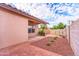 Spacious backyard with a brick patio, low maintenance landscaping, and block wall fencing at 910 W Redondo Dr, Gilbert, AZ 85233