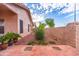 Backyard featuring a block wall fence, a covered patio, and low-maintenance desert landscaping at 910 W Redondo Dr, Gilbert, AZ 85233